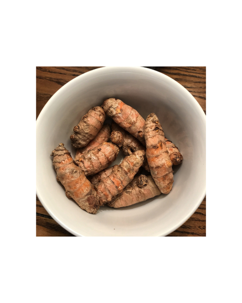 bowl of fresh turmeric root